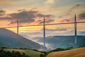 Viaduc de Millau bridge over Tarn river valley at sunrise, Millau, Aveyron Department Viaduc de Millau bridge over Tarn river valley at sunrise, Millau, Aveyron Department