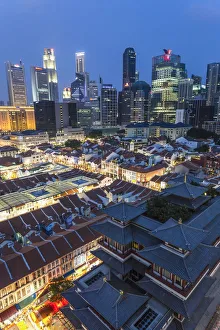 View over Buddha Tooth Relic Temple & city skyline at dusk, Chinatown, Singapore View over Buddha Tooth Relic Temple & city skyline at dusk, Chinatown, Singapore