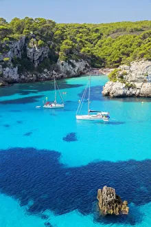 View of Cala Macarelleta and sailboats, Menorca; Balearic Islands; Spain; Europe View of Cala Macarelleta and sailboats, Menorca; Balearic Islands; Spain; Europe