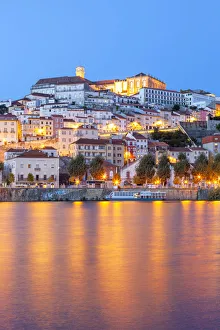 View of Coimbra ol town and Mondego River at dusk. Coimbra, Coimbra district View of Coimbra ol town and Mondego River at dusk. Coimbra, Coimbra district