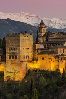 View at dusk of Alhambra palace with the snowy Sierra Nevada in the background, Granada View at dusk of Alhambra palace with the snowy Sierra Nevada in the background, Granada