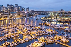 View over harbour & Granville Island with city skyline at dusk, Vancouver, British Columbia View over harbour & Granville Island with city skyline at dusk, Vancouver, British Columbia