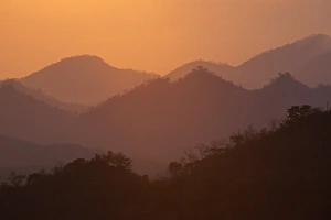 Laos Travel Photography Prints: View of hills at sunset from the summit of