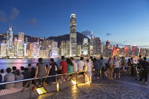 View of Hong Kong Island skyline from Tsim Sha Tsui promenade at dusk, Hong Kong, China View of Hong Kong Island skyline from Tsim Sha Tsui promenade at dusk, Hong Kong, China