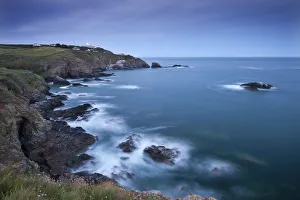 View from Lizard Point over rocky Polpeor Cove and onto the Lizard Lighthouse View from Lizard Point over rocky Polpeor Cove and onto the Lizard Lighthouse