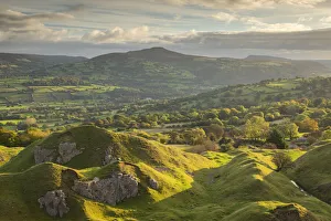 View out over the old quarry below the Llangattock Escarpment towards the Sugar Loaf View out over the old quarry below the Llangattock Escarpment towards the Sugar Loaf