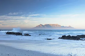 View of Table Mountain from Bloubergstrand beach at sunrise, Cape Town, Western Cape View of Table Mountain from Bloubergstrand beach at sunrise, Cape Town, Western Cape