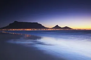 View of Table Mountain at dusk from Milnerton beach, Cape Town, Western Cape, South View of Table Mountain at dusk from Milnerton beach, Cape Town, Western Cape, South