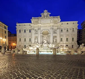 View of Trevi Fountain illuminated by street lamps and the lights of dusk Rome Lazio View of Trevi Fountain illuminated by street lamps and the lights of dusk Rome Lazio