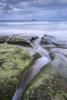 Waves wash over sandstone ledges at Harlyn Beach in Cornwall, England. Spring (May) 2021 Waves wash over sandstone ledges at Harlyn Beach in Cornwall, England. Spring (May) 2021