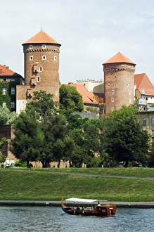 Wawel Hill Castle above Boat on the Vistula River Wawel Hill Castle above Boat on the Vistula River