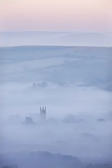 Widecombe-in-the-Moor Church surrounded by mist at dawn, Dartmoor National Park, Devon Widecombe-in-the-Moor Church surrounded by mist at dawn, Dartmoor National Park, Devon