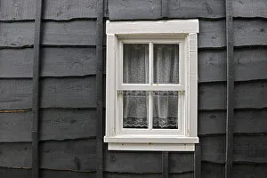Window of an old wooden house called palheiro. Tocha, Portugal Window of an old wooden house called palheiro. Tocha, Portugal