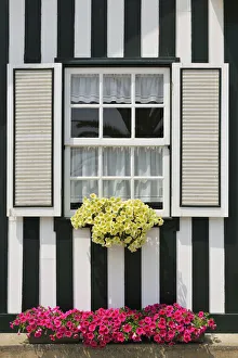 Window of a traditional striped painted house in the little seaside village of Costa Nova Window of a traditional striped painted house in the little seaside village of Costa Nova