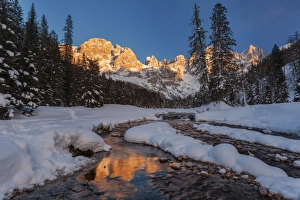 Winter sunset over the St Martins blades, Dolomites, Italy Winter sunset over the St Martins blades, Dolomites, Italy