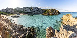 Woman bathing at Cala Napoletana at Caprera Island, La Maddalena Archipelago, Sardinia Woman bathing at Cala Napoletana at Caprera Island, La Maddalena Archipelago, Sardinia