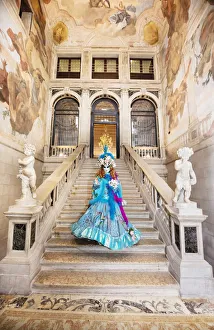 Woman in costume standing on staircase in Ca Segredo palace during Carnival, Venice Woman in costume standing on staircase in Ca Segredo palace during Carnival, Venice
