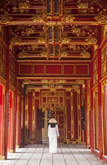 Woman wearing Ao Dai dress in Imperial Palace inside Citadel, Hue, Thua Thien-Hue Woman wearing Ao Dai dress in Imperial Palace inside Citadel, Hue, Thua Thien-Hue