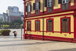 Women walking past Central Library on Tap Seac Square Macau, China Women walking past Central Library on Tap Seac Square Macau, China