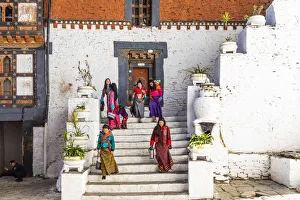 Women walking in Trongsa Dzong, Trongsa District, Bhutan Women walking in Trongsa Dzong, Trongsa District, Bhutan