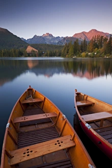 Wooden boats on Strbske Pleso lake in the Tatra Mountains of Slovakia, Europe. Autumn Wooden boats on Strbske Pleso lake in the Tatra Mountains of Slovakia, Europe. Autumn