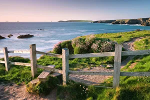 Wooden stile on Cornish clifftops near Porthcothan Bay, South West Coast Path long Wooden stile on Cornish clifftops near Porthcothan Bay, South West Coast Path long