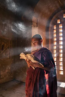 A young monk reading by a window, Bagan Temple Print