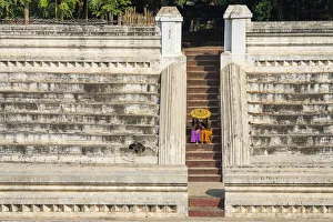 Two young women sitting at stairs at Khan Taw Mingalar, Mandalay, Mandalay Region Two young women sitting at stairs at Khan Taw Mingalar, Mandalay, Mandalay Region