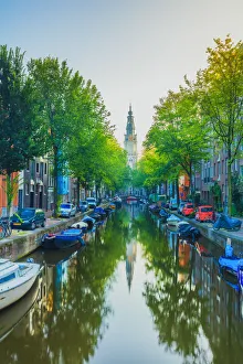 Zuiderkerk church in Amsterdam reflecting in the Groenburgwal canal, Holland/Netherlands Zuiderkerk church in Amsterdam reflecting in the Groenburgwal canal, Holland/Netherlands