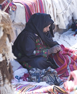 An arabic women in Dahab on the Red Sea in the Sinai Desert Egypt making goods An arabic women in Dahab on the Red Sea in the Sinai Desert Egypt making goods
