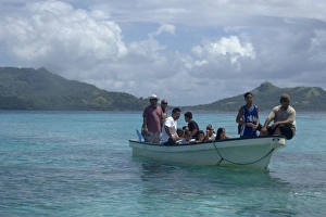 Boat with local family approaches island for a day trip, Truk lagoon, Chuuk, Federated States of Micronesia, Pacific Boat with local family approaches island for a day trip, Truk lagoon, Chuuk, Federated States of Micronesia, Pacific