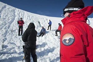 A group of mountaineers building snow holes on Cairngorm in the Cairngorm National Park in Scotland UK A group of mountaineers building snow holes on Cairngorm in the Cairngorm National Park in Scotland UK