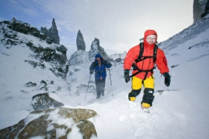 Hikers in a blizzard near the Old Man of Storr on the isle of Skye Scotland Hikers in a blizzard near the Old Man of Storr on the isle of Skye Scotland