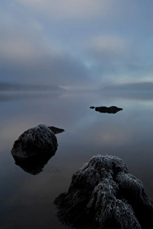 Loch Awe on a misty frosty morning, rocks in foreground, facing west. Argyll, Scotland Loch Awe on a misty frosty morning, rocks in foreground, facing west. Argyll, Scotland
