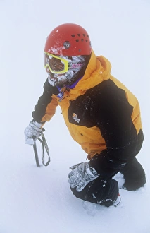 A mountaineer in the Cairngorm mountains in Scotland in winter, UK A mountaineer in the Cairngorm mountains in Scotland in winter, UK