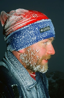 A mountaineer covered in Hoare Frost on Helvellyn Cumbria UK A mountaineer covered in Hoare Frost on Helvellyn Cumbria UK