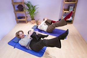 Female Fitness Trainer Prints: A Pilates instructor and student doing Pilates