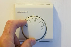 setting the central heating thermostat at a cooler temperature to save energy setting the central heating thermostat at a cooler temperature to save energy