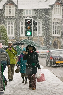 Shoppers trudging through snow in Ambleside UK Shoppers trudging through snow in Ambleside UK