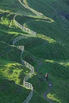 A winding fence and the South West Coast Path near Port Isaac in Cornwall UK A winding fence and the South West Coast Path near Port Isaac in Cornwall UK