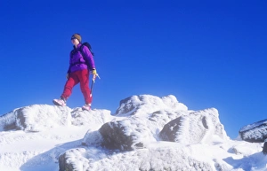 A woman mountaineer on Crinkle Crags in the Lake district, UK A woman mountaineer on Crinkle Crags in the Lake district, UK