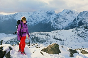 A woman walking on Crinkle Crags in the Lake District UK A woman walking on Crinkle Crags in the Lake District UK