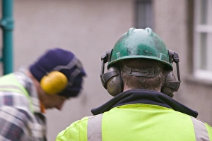 Construction Worker Safety Gear Prints: Workmen using ear protectors