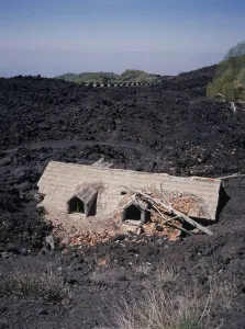 Print of a house destroyed by Mount Etna lava flow