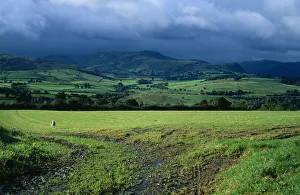 England, Cumbria, Lake District, View across green field from Blencathra centre towards England, Cumbria, Lake District, View across green field from Blencathra centre towards