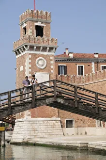 Italy, Veneto, Venice, Arsenale, bridge with couple & the walls of the Arsenale Italy, Veneto, Venice, Arsenale, bridge with couple & the walls of the Arsenale