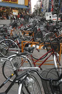 Japan Tokyo Shinjuku outside station bicycles clutter the sidewalk Japan Tokyo Shinjuku outside station bicycles clutter the sidewalk