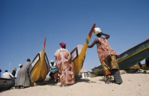 SENEGAL, Soumbedioune Women wearing brightly coloured traditionally patterned clothing SENEGAL, Soumbedioune Women wearing brightly coloured traditionally patterned clothing