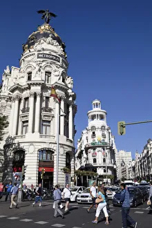Spain, Madrid, Busy traffic on Alcala Grand Via junction next to the Metropolis building Spain, Madrid, Busy traffic on Alcala Grand Via junction next to the Metropolis building