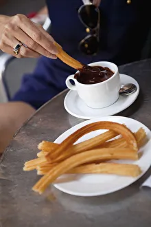 Spain, Madrid, Eating churros with hot chocolate Spain, Madrid, Eating churros with hot chocolate